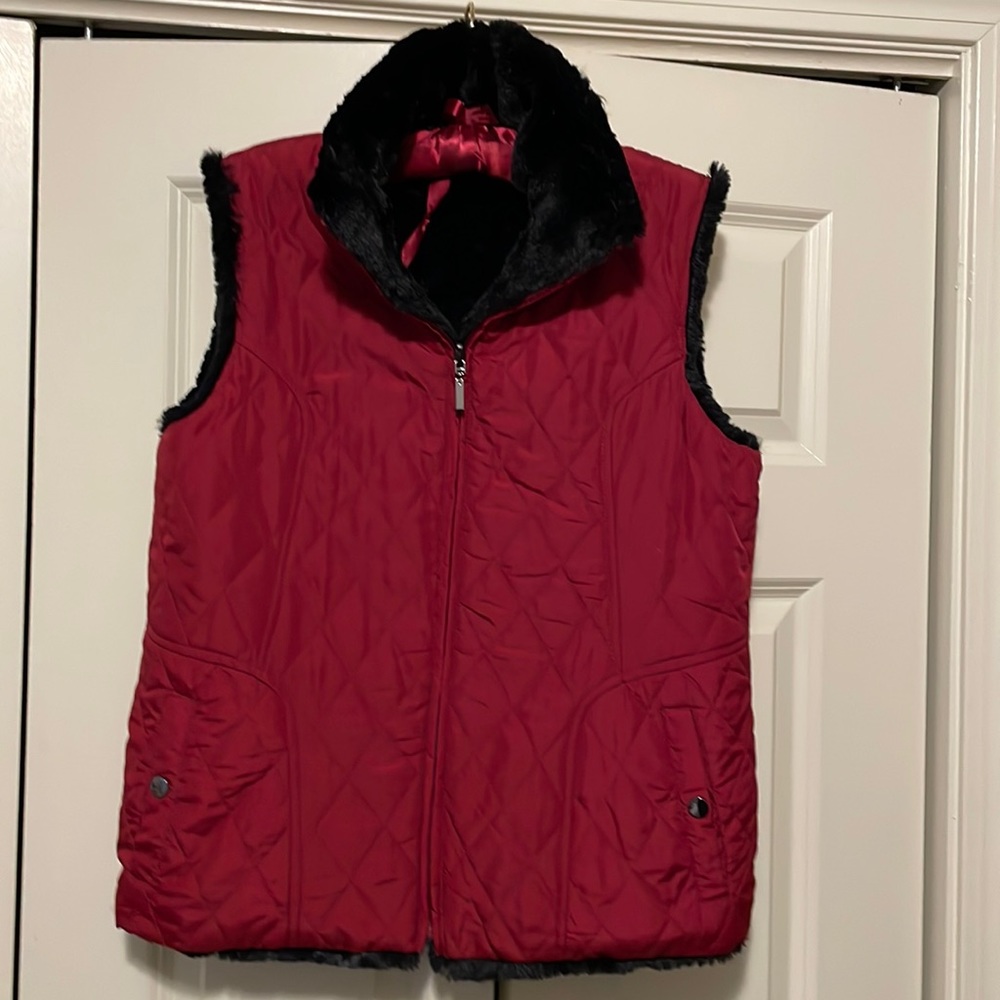 Cute red vest with black trim.  Believe it’s a size M